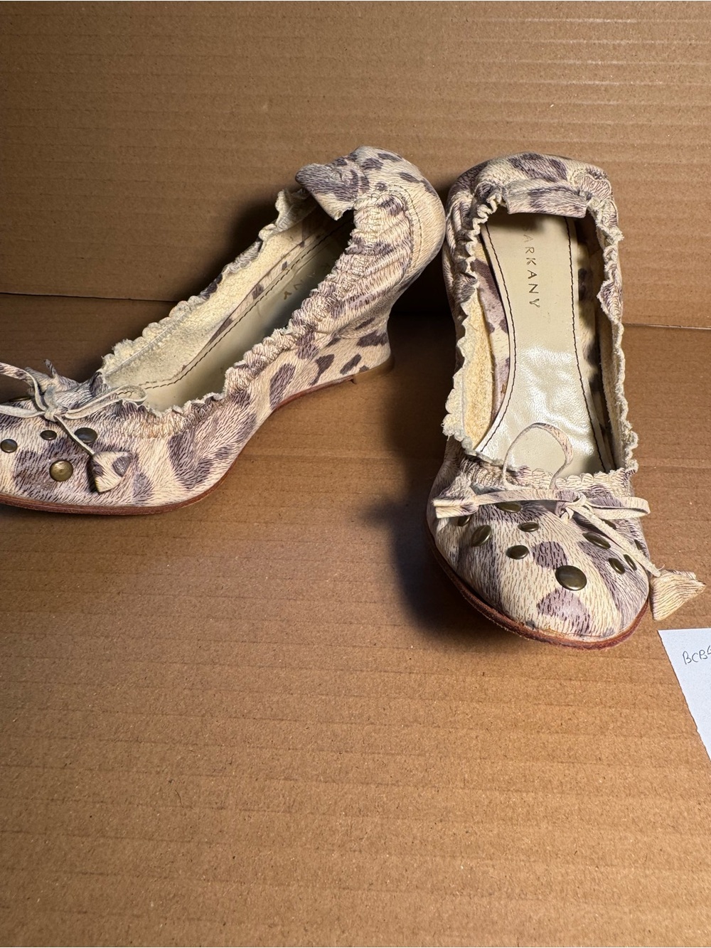 Beige Leopard-Print Ruffle with Stud Accents wedge shoes.